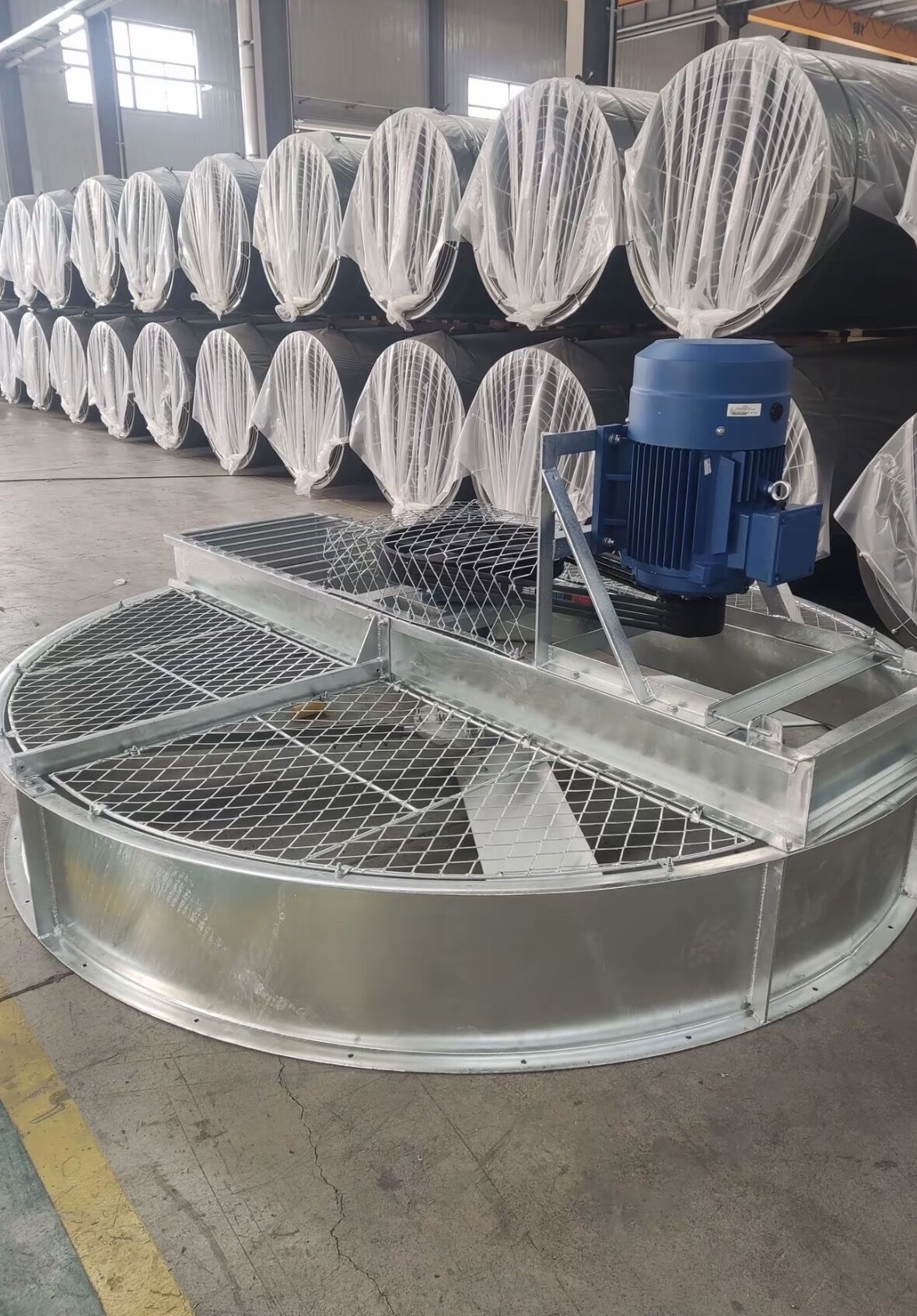 Large cooling tower fans in workshop for final testing